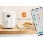 Xiaomi Mi Smart Air Fryer 3.5L with a plate of fries and a smartphone displaying the connected app controls